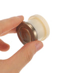 Close-up of Vintage Metal Spring Loaded Push To Open Cabinet Knobs No Visible Screws Invisible Mount Round Wardrobe Handles