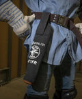 Person wearing flame-resistant electrode bag with hard leather bottom and belt loop, heavy-duty No 4 canvas, NFPA 701 compliant