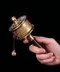 Copper Hand Held Prayer Wheel For Home And Office Decor, Tibetan Buddhist Hand Turn Praying Instrument, artisan detail view