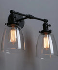 Retro Industrial 2-Light Wall Sconce Set With Dual 5.6 Inch Bell Shaped Clear Glass Lampshades, Black Finish, Side View
