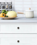 Slick Abstract Marble Fluid Art White Glass Drawer Knobs Set In Black Gold Finish 4 Pack on white kitchen drawer