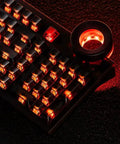 Close-up of 98 Key Silent Mechanical Keyboard With Hot Swappable RGB Lighting And Tri Mode Wireless Setup with red backlighting.