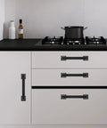 Modern kitchen with 10 Pack Matte Black 5 Inch 128mm Cabinet Handles Zinc Alloy Drawer Pulls on white cabinets.