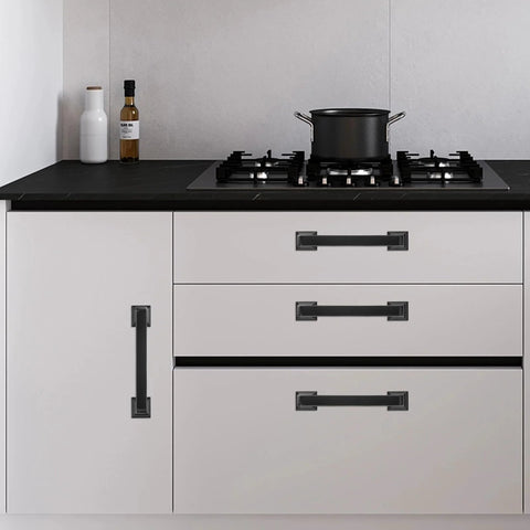 Modern kitchen with 10 Pack Matte Black 5 Inch 128mm Cabinet Handles Zinc Alloy Drawer Pulls on white cabinets.