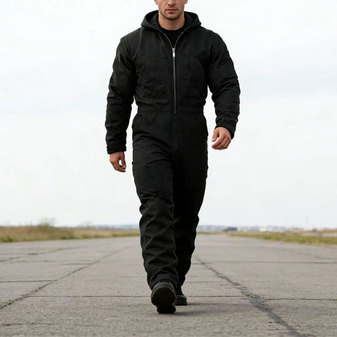 Mens Heavy Duty Canvas Work Jumpsuit With Thermal Hood And Full Zip Front Insulated Coveralls For Construction Trades, walking on a runway.