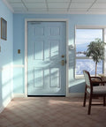 Interior view of a closed light blue door with snow outside, showcasing the Eight Pack Door Brush Seal Kit With 2.5 Inch Bristles.