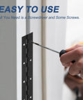 Hella Durable Black 24 X 2 Inch Stainless Steel Piano Hinge With Pre Drilled Holes being installed using a screwdriver.