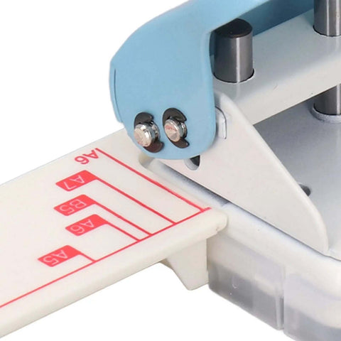 Close-up of a Three Hole Paper Punch Handheld Puncher For Binders showing alignment guide and heavy duty metal body for school and home use.