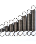 Heavy Duty Dual Hook Tension Springs Crafted From Heat Tempered Steel, various sizes stacked, perfect for marine equipment and home repairs.