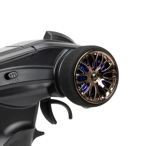 Close-up of the steering wheel of Beefy 2.4G 3CH RC Transmitter And Receiver Set For Axial SCX10 1 By 10 RC Crawler Car Boat Tank