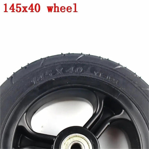 Close-up of 145x40 solid tire with plastic hub for 6 Inch Solid Tire Set For Electric Skateboard Longboard Airless Wheel 145x40 With Plastic Hub And Pulley Upgrade Durable Grippy Tread For Wet And Dry Roads Great For Street Use.