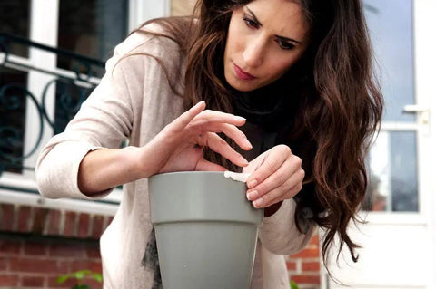 Person repairing a pot with Epoxy Repair Putty For Quick Fixes Handy Two Part Moldable Adhesive That Bonds To Damp Surfaces