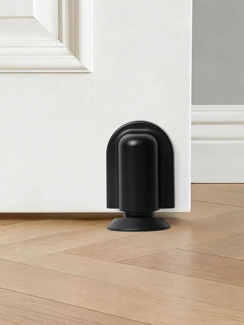 Matte Black Magnetic Door Stopper Holds Interior Doors Firmly Open Heavy Duty Floor Mounted Catch with screw install on hardwood.