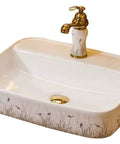 New Premium Ceramic Rectangle Vessel Sink For Bathroom Vanity Sleek Above Counter Wash Basin Slick Glossy Finish No Sweat Cleanup Hand Painted Art Style with floral design and gold faucet.