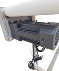 Close-up of motor on Electric PVC Belt Conveyor With Adjustable Speed Desktop Industrial Transport Unit Stainless Steel Frame