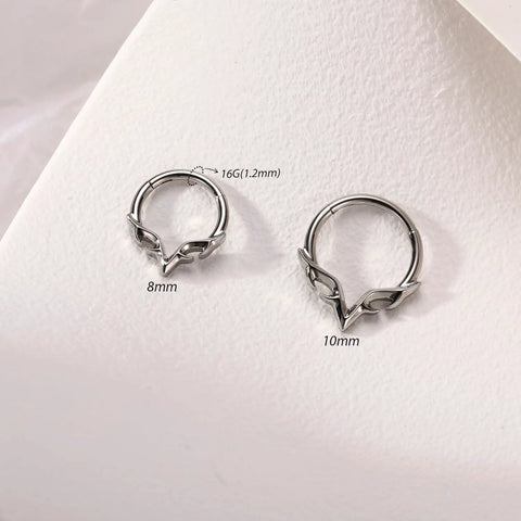 Blade Wings Septum Ring With V Shape Hinged Segment Clicker 16G 8mm 316L Surgical Steel Silver Nose Jewelry displayed on surface.