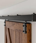 8 Ft Box Rail Sliding Barn Door Track Kit installed on wall with a wooden door, heavy duty aluminum alloy, smooth quiet operation