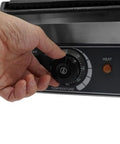 Adjusting temperature dial on Heavy Duty 1800W Commercial Sandwich Panini Press Grill. Stainless Steel Electric Toaster Oven.