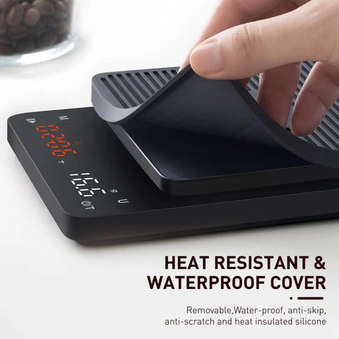 Silicone cover being lifted on a Precision Coffee Scale With Timer For Pour Over And Espresso, 0.1g High Precision Kitchen Scale