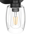 Close-up of Three Light Black Vanity Light Fixtures Over Mirror With Clear Glass Shades, Industrial Modern Bathroom Lighting
