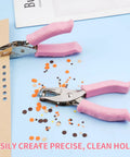 Dual Hole Punch Set With Soft Grip Handles In Pink for crafts with 1/8" and 1/4" holes, showing clean cuts in paper confetti.