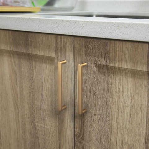 5 Inch Champagne Bronze Cabinet Pull Handles 6 Pack With Grooved Texture And Non Slip Grip For Farmhouse And Industrial Cabinetry Decorative Hardware For Cabinets And Dressers installed on wooden kitchen cabinets.