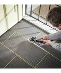 5 Amp Tool-Less Oscillating Tool Kit With Accessory Set For Cutting Sanding Grinding And Scraping in use on floor tiles