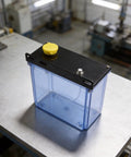 Heavy Duty 3L CNC Lubrication Water Box With Integrated Filter For Lathe Milling Drill Machines on worktable, showing top view.
