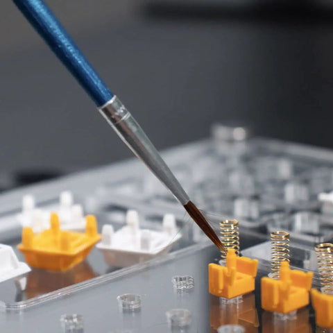 Close-up of brush applying lubricant in Two Layer Switch Lubrication Station For Mechanical Keyboards With Quick 33 Switch Lube Capability