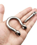 Two Pack Three Eighth Inch Screw Pin Anchor Shackle Premium 304 Stainless Steel, heavy duty rigging in hand.