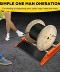 Heavy Duty Cable Drum Roller Dispenser Stand Unwinder For Reels Up To 28 Inch Wide in use, showing smooth cord management.