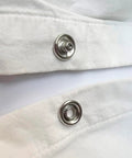 Close-up of 11mm snap fasteners on white fabric, part of Snaps With Fastener Pliers Press Tool Kit 40 Set 11mm Snap Fasteners Kit Snap Buttons For DIY Sewing And Crafting Easy To Install With Included Adapters And Pliers Perfect For Clothing Bags Quilting And Home Crafts