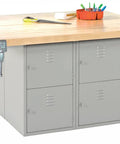 Badass Heavy Duty Garage Workbench Rock Solid Hardwood Table Four Quick Release Vises Eight Bay Secure Lockers gray industrial setup