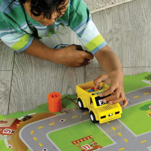Switcheroo Coding Crew Screen Free Robot Kit For Kids Hands On Push Button Coding To Learn Sequencing Logic And Problem Solving Through Rescue Mission Play And Totally Imaginative STEM Adventures, child using yellow robot truck