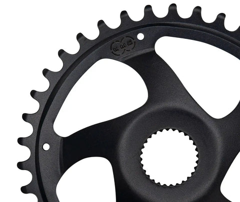 Close-up of the Gen4 Chain Ring 38T 52mm Black for Bosch Performance Line CX and Speed MY2020, featuring teeth and mounting hole.