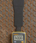 Palm Sized Digital Multimeter For On The Go Tech Work Measures Voltage Resistance Continuity And Capacitance With 10A Current Data Hold Lightweight About 200 Grams CAT III 600V Safety Rating Slim Pocket Tool For Quick Troubleshooting on metal surface