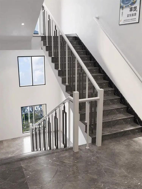 Tough As Nails Black Metal Stair Railing Balusters, Rustproof Wrought Iron Posts for Decks and Porch Steps, shown on a stylish staircase.