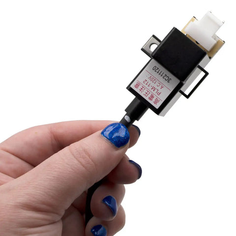 Hand holding RTG20235C Tankless Gas Water Heater Ignitor Coil Replacement 120V Igniter Coil, close-up view