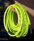 ZillaGreen Air Hose Three Eighth Inch By Fifty Feet With Quarter Inch MNPT Fittings shown coiled in hand