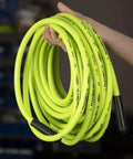 Zero Hassle All Day Grind Air Hose 3/8 X 35 Foot Heavy Duty Flexible Hybrid Polymer in bright yellow being held.