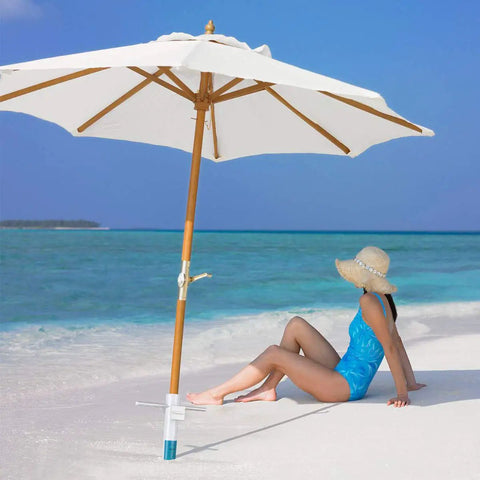 Windproof Beach Umbrella Sand Anchor With Five Spiral Screw Design Heavy Duty ABS Base Stand on beach with woman sitting nearby.