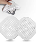 Real Deal Silicone Drain Hair Catcher 2 Pack With Grip Secure Suction Cups For Shower Sink Strainer showing two white silicone hair catchers.