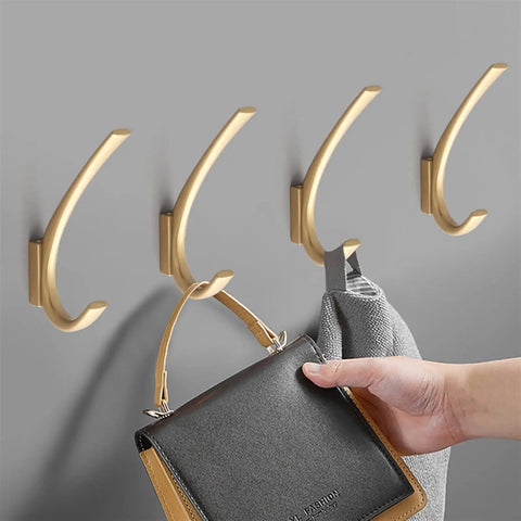 Knockout Vintage Black Zinc Alloy Wall Mount Hooks Slick Scratch Resistant Towel Ring And Coat Hanger For Bath Or Entryway heavy-duty hooks holding a handbag and towel.