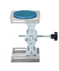 Lab scissor jack stand with blue 4x4 inch round anti-slip platform, stainless steel, adjustable height 50–160 mm.