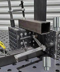12 Pack Welding Table Fixture Pins Five Eighths By One By One Point Five Inches Aluminum Quick Setup Fixturing Kit with square tube fixed pins in use on a welding table.