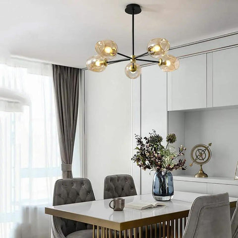 5-Light Sputnik Chandelier With Airblown Glass Globes In Sleek Smoke Grey, adjustable height, in dining area with table and decor.