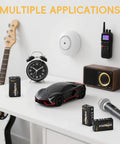 Long-Lasting 9V Carbon Zinc Batteries 6F22 Pack of 4 displayed with guitar, microphone, alarm clock, and smoke detector