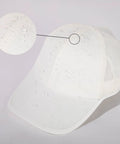 White UPF 50 Plus Ponytail Baseball Cap For Women Size Small Medium with water droplets showing instant dry cooling tech