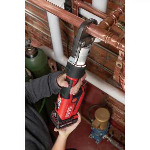 Hands using ProPress RP 351 Press Tool Kit With 18V Battery Charger MegaPress Jaws One Half In To One In Case on copper pipes