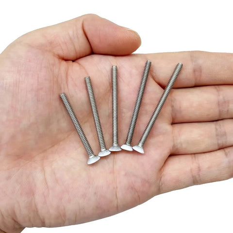 Heavy Duty Extra Long Outlet Mounting Screws Forty Piece Pack Six Thirty Two Gauge One And Half Inch Reach White Painted Phillips Countersunk Heads in hand
